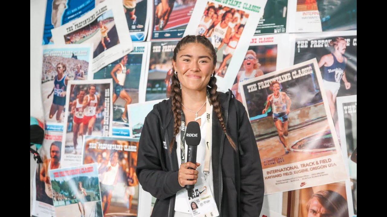 Tanis Chavez holding a microphone in front of track-and-field posters, from her highlight reel thumbnail